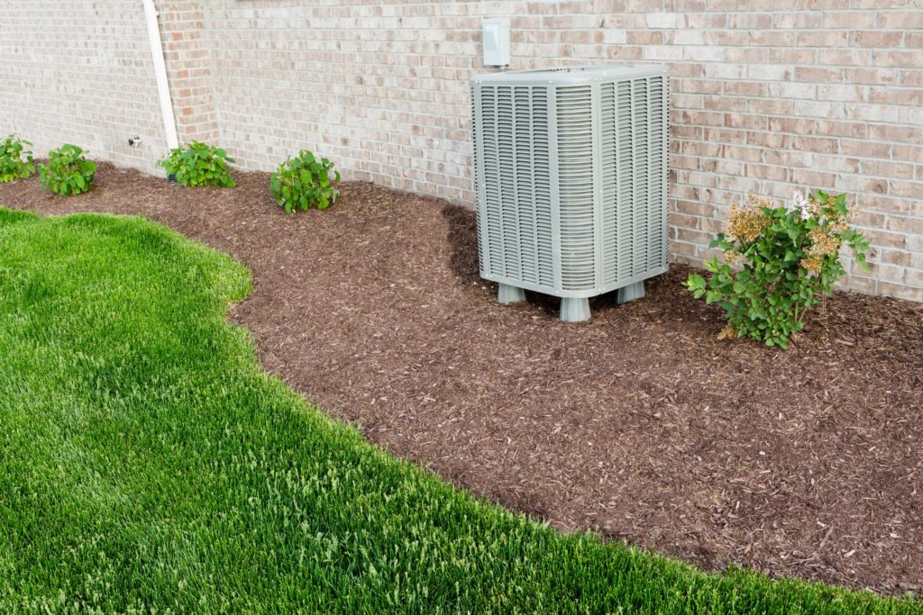 air conditioner near the grass